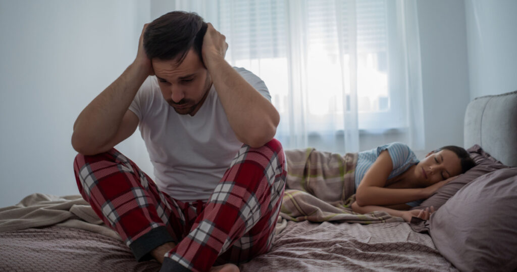 Young man is having trouble with sleep.