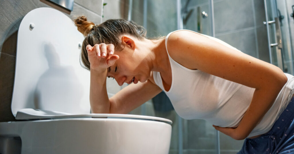 vommiting into toilet