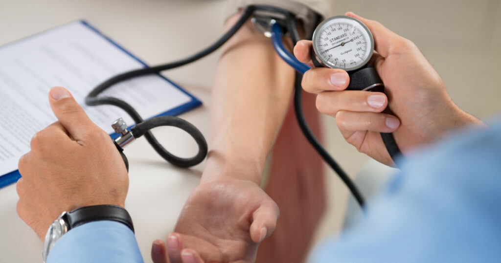 Close Up Of A Doctor Checking Blood Pressure Of A Patient
