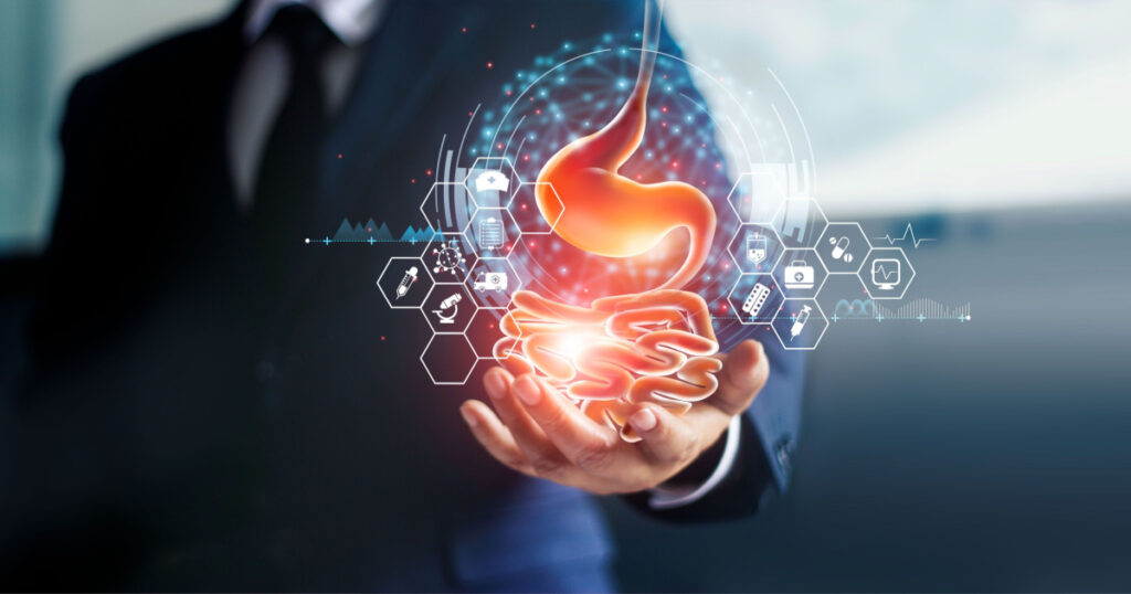 Businessman holding stomach in hand and stomach ache from gastritis or GERD (gastroesophageal reflux disease).Digestive disorder causes patient heartburn pain or acid indigestion.Medical and health.