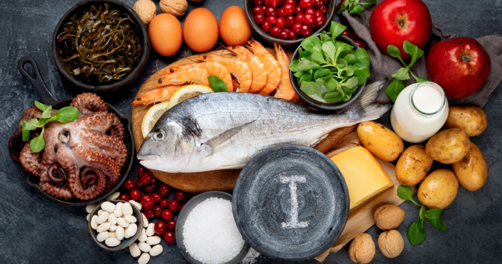 Food high in iodine on dark gray background. Healthy eating concept. Top view, flat lay