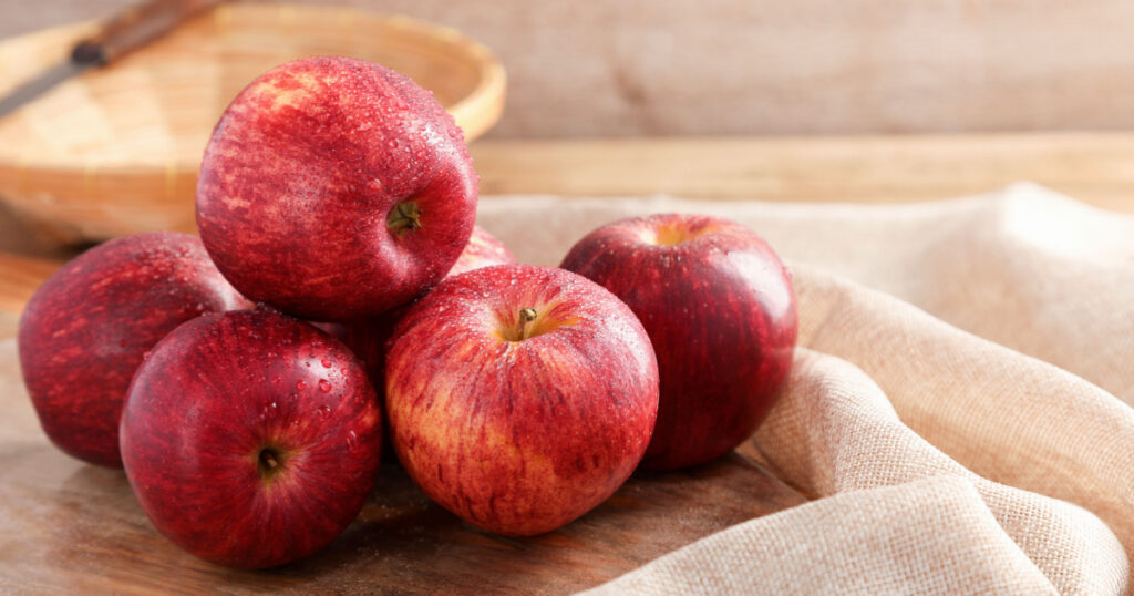 Group of Gala Apple on wooden board background, Fruits concept.