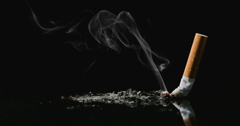 World No Tobacco Day Concept. Stop Smoking. Tobacco cigarette butts on the floor. health concept The more you smoke, the worse your health and life.