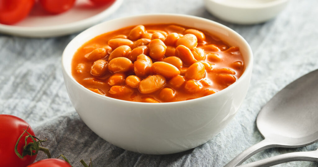 Bowl of cooked beans in tomato sauce