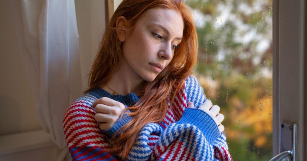 Depressed woman suffering seasonal depression, feeling blue
