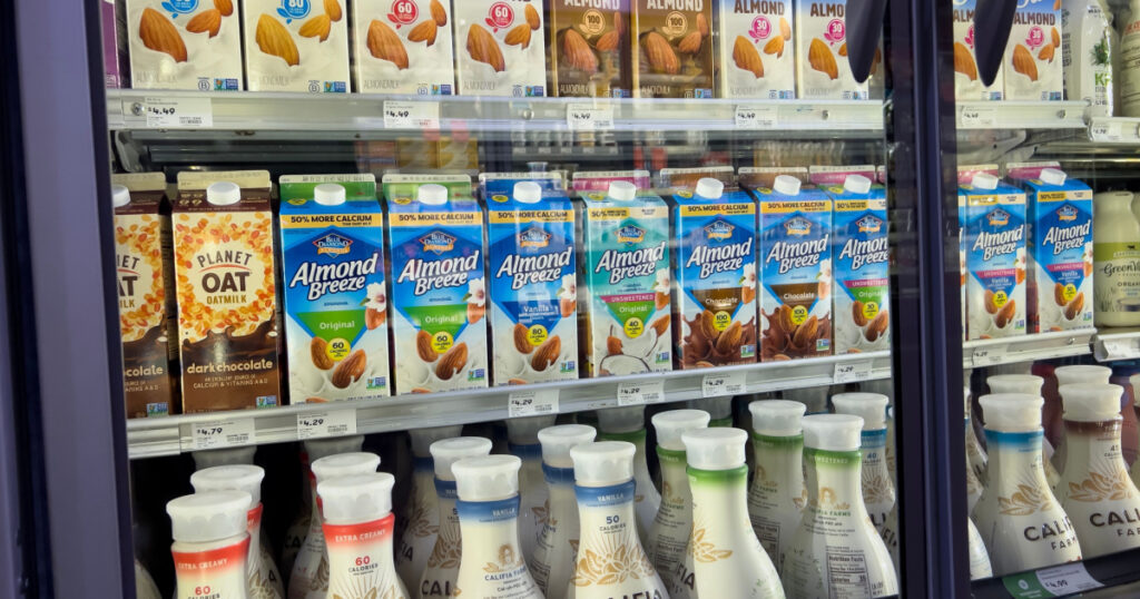 Mill Creek, WA USA - circa April 2022: Angled, selective focus on dairy products inside the refrigerated section of a Town and Country grocery store.