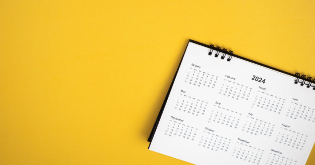 Calendar year 2024 schedule on yellow background. 2024 calendar planning appointment meeting concept. copy space. top view.