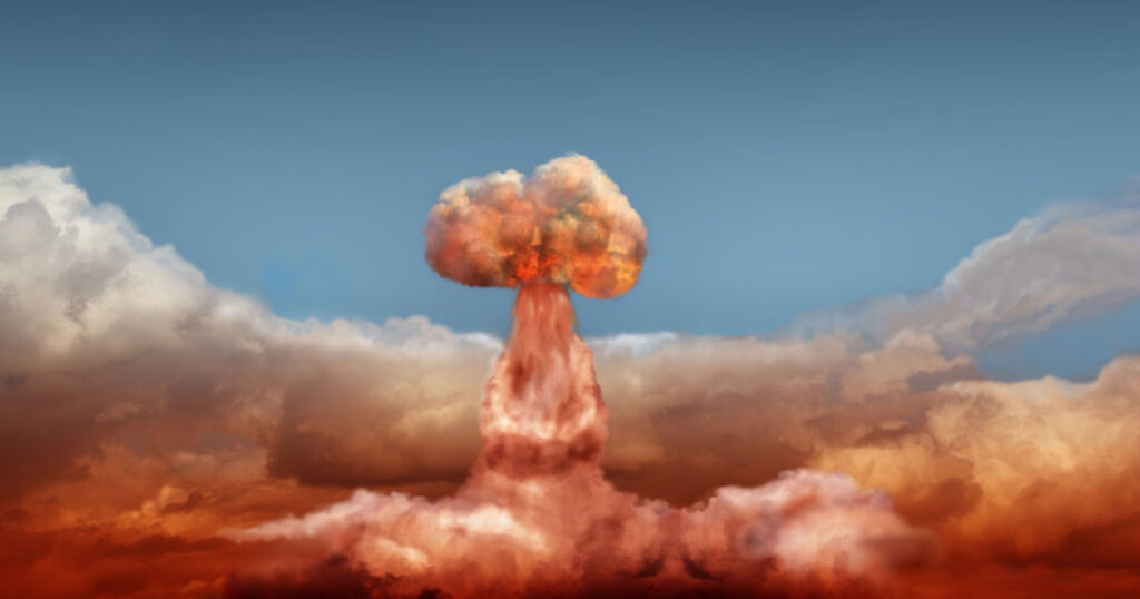explosion of atomic bomb on background of sky