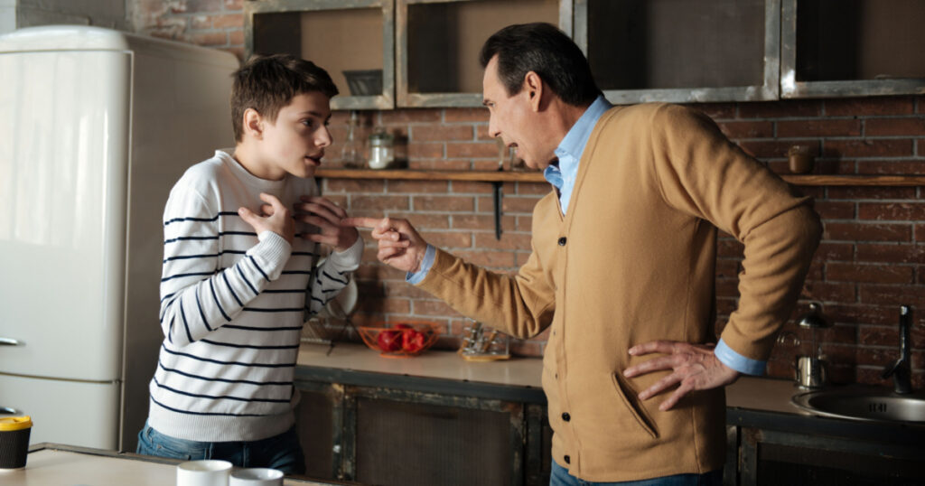Shocked boy looking at his father