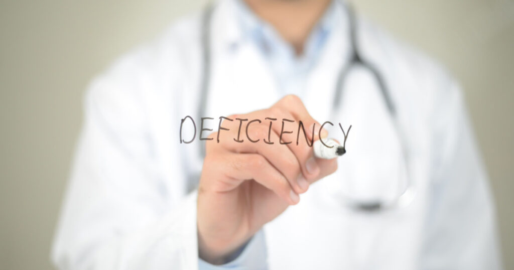 Deficiency , Doctor writing on transparent screen