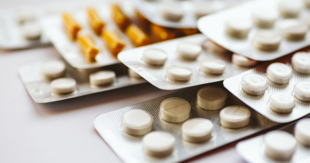 Different medicines: tablets, pills in blister pack, medications drugs, macro, selective focus, copy space