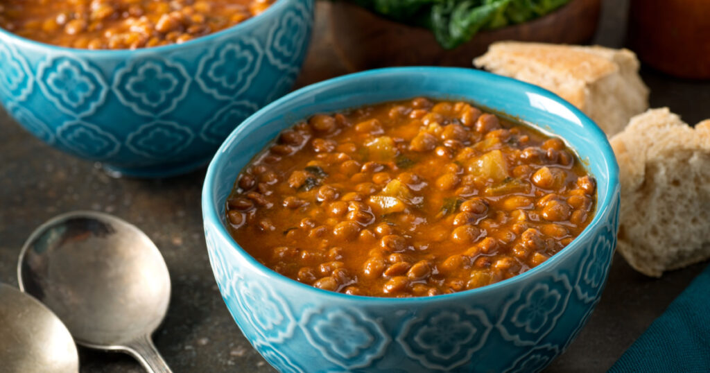 A bowl of delicious hearty homemade curried lentil soup.

