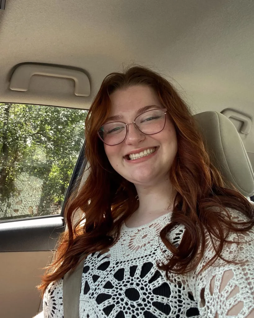 Woman smiling in a car