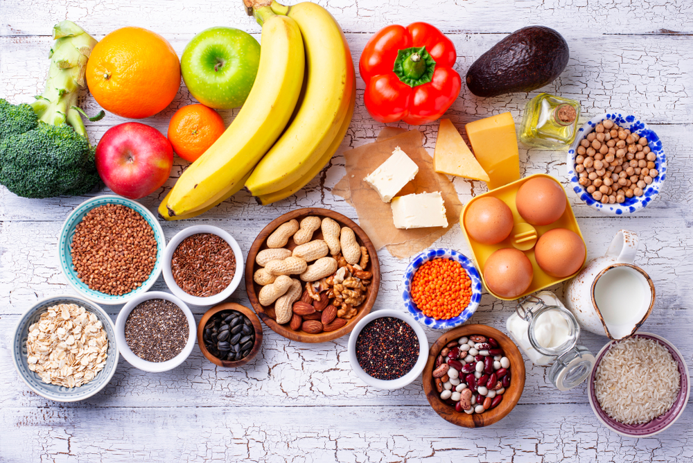 Ovo-lacto vegetarian diet concept. Fruits, vegetables, dairy products, eggs, seeds, healthy fats and grains