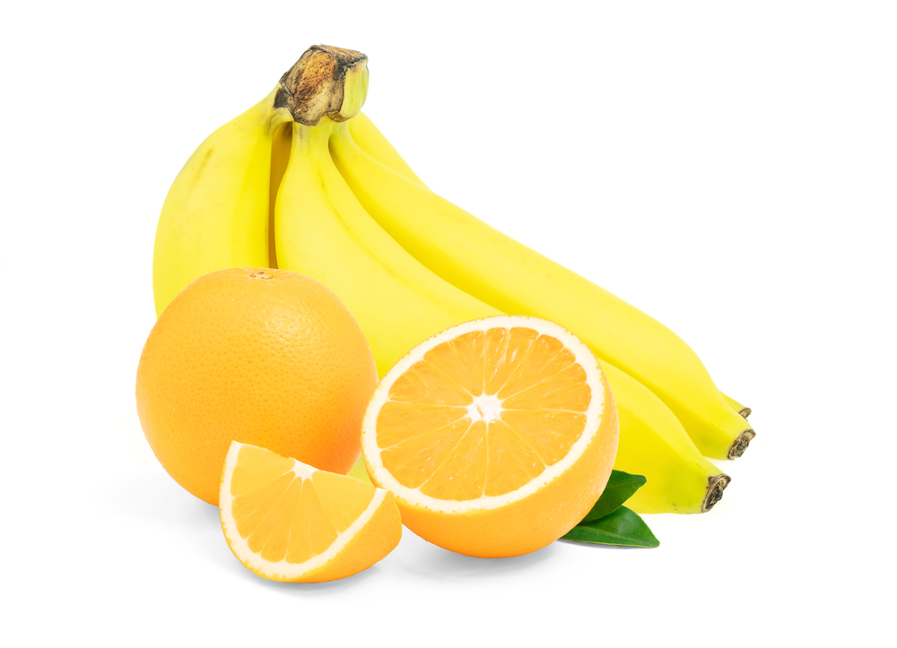 Banana with Orange fruit cut half and slice and green leaf isolated on white background, food benefits for health and diet
