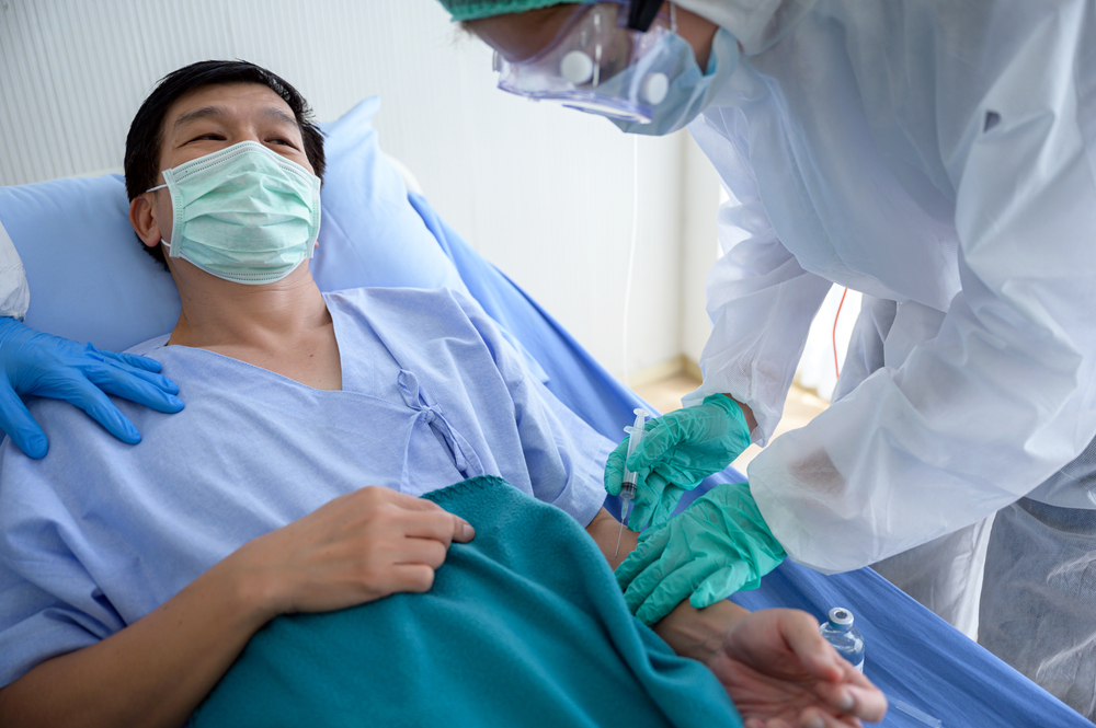 Infected coronavirus patient on quarantine in the bed at the hospital