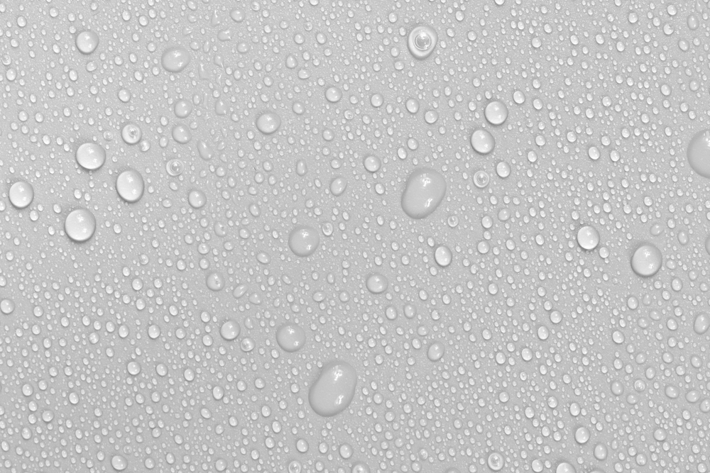 Water drops on white background texture. backdrop glass covered with drops of water. bubbles in water