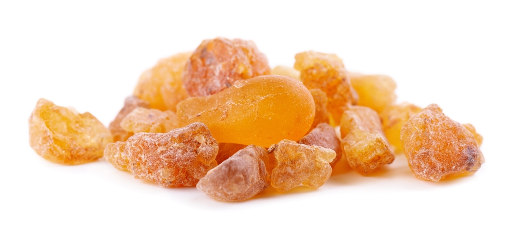 Frankincense resin isolated on white background. Pile of natural frankincense Olibanum. Incense