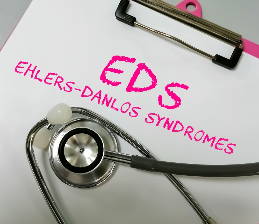 Ehlers-Danlos syndrome term on white background with stethoscope. rare disease.