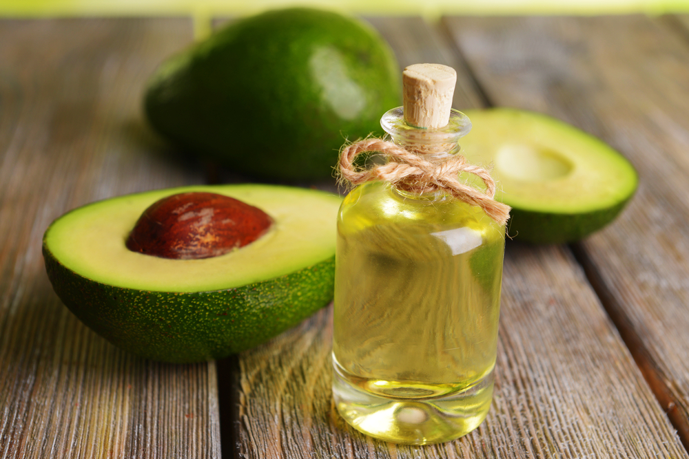 Avocado oil on table close-up