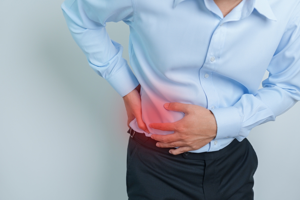 man having back pain. Urinary system and Stones, Cancer, world kidney day, Chronic kidney stomach, liver pain and pancreas concept
