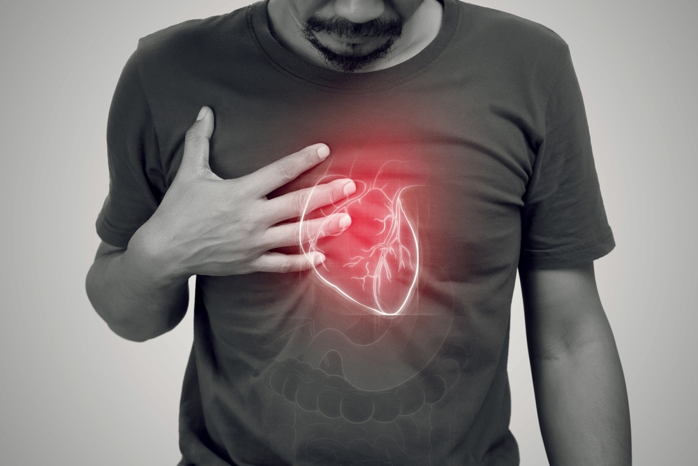 Heart failure of asian man on a gray background.
