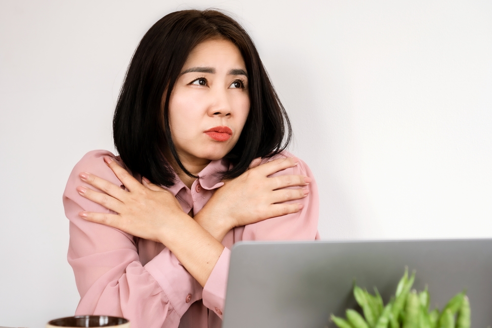 Asian woman feeling cold all the time caused by Anemia, Hypothyroidism or Raynaud's disease"