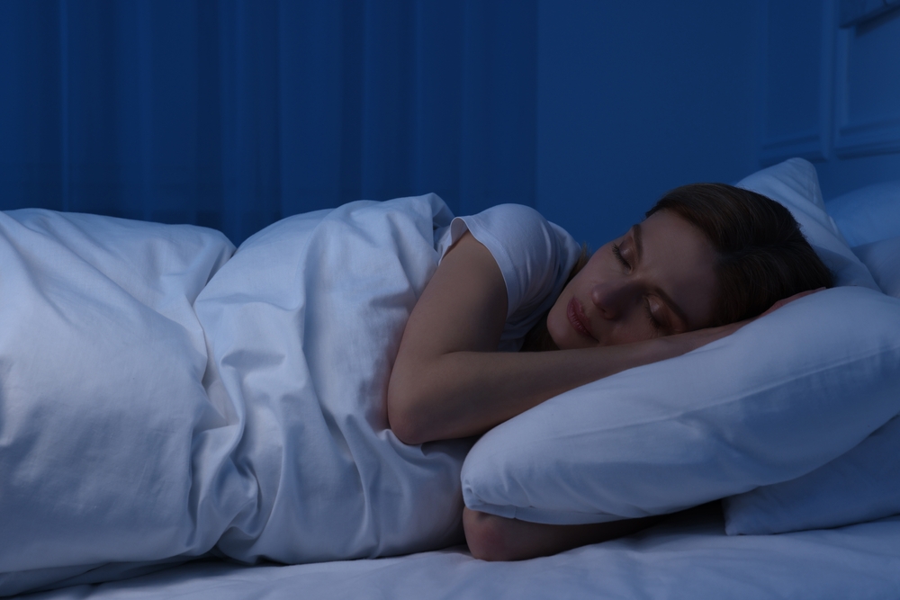 Beautiful woman sleeping in bed at night
