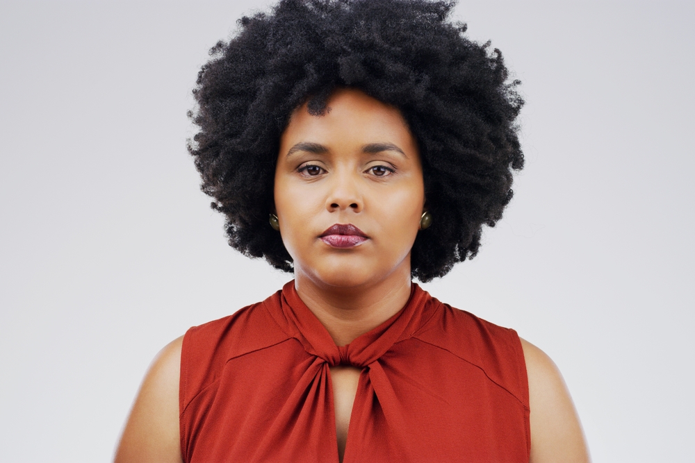 Studio, serious and portrait and black woman in creative career for media company, magazine and newspaper isolated on white background. Closeup, face and young graduate for internship in writing job
