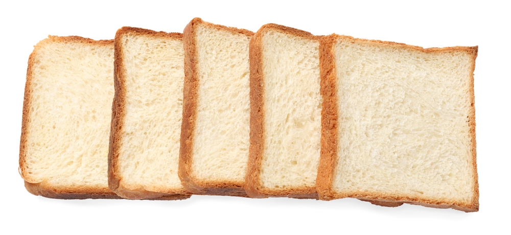 Pieces of fresh toast bread isolated on white, top view
