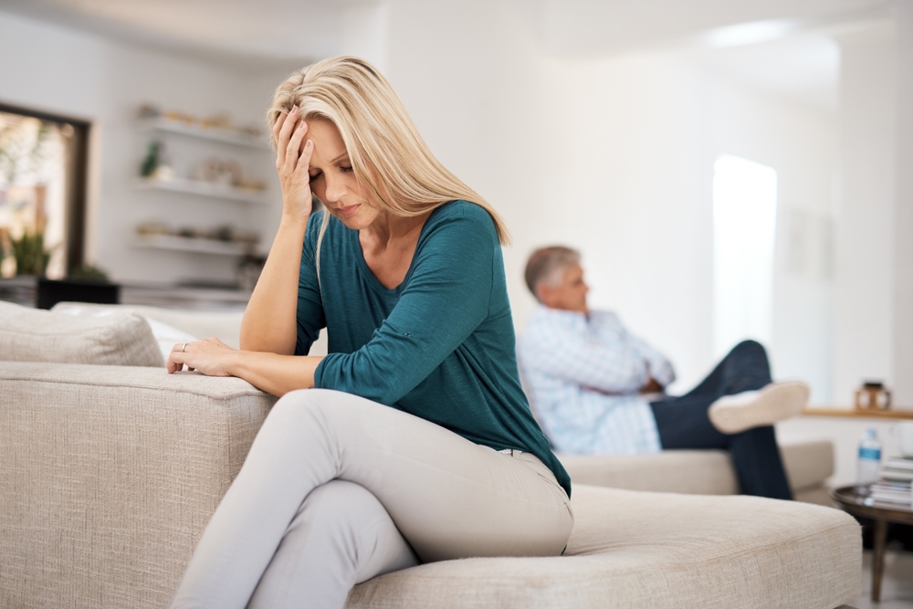 Couch, couple and fight in home for annoyed, divorce or married people for argument. Disagreement, sofa and lounge for frustrated woman, affair or emotion in toxic relationship with mature partner
