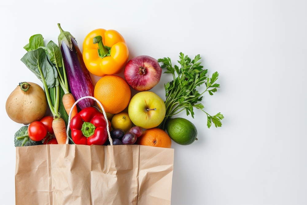 Healthy food background. Healthy food in paper bag vegetables and fruits on white. Food delivery, shopping food supermarket concept