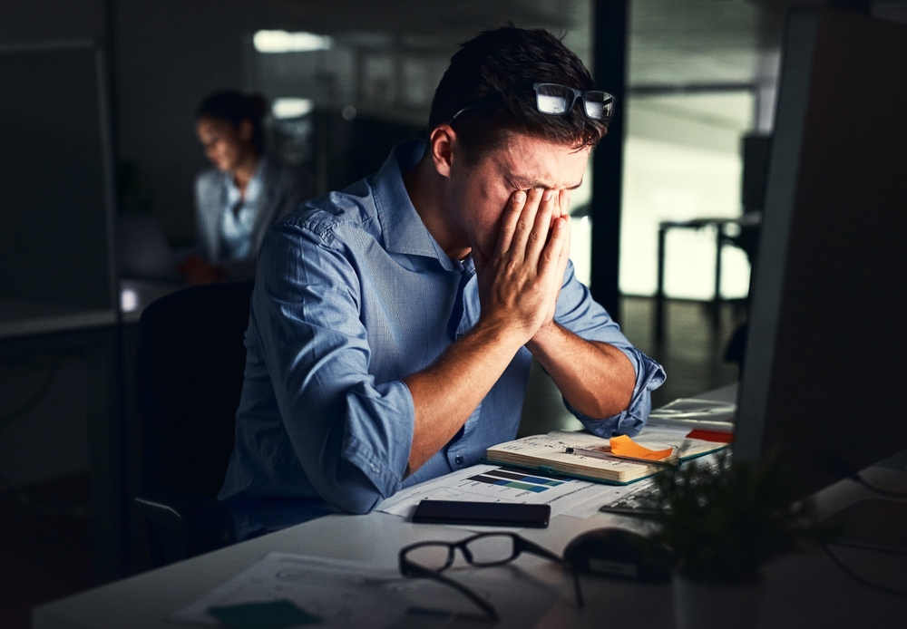Man, stress and business or night office, working late and worried for company deadline. Mental health, crisis and headache for audit preparation, corporate and dark workplace for finance advisors
