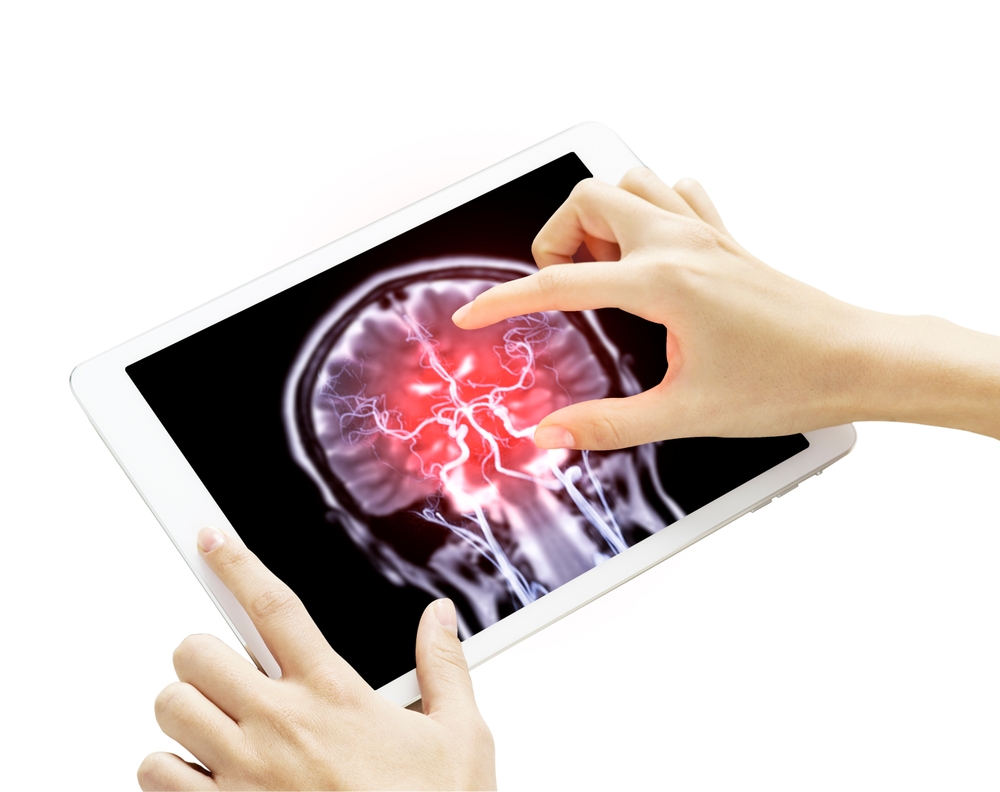 The hand gestures towards a tablet displaying detailed of MRI brain Coronal T2W with Cerebral artery fusion image isolated on white background. Clipping path.
