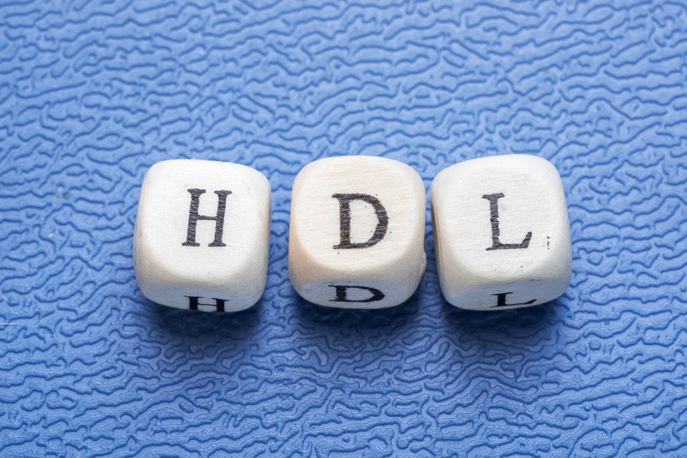 Word hdl (high-density lipoprotein) on a wooden cubes on a blue background