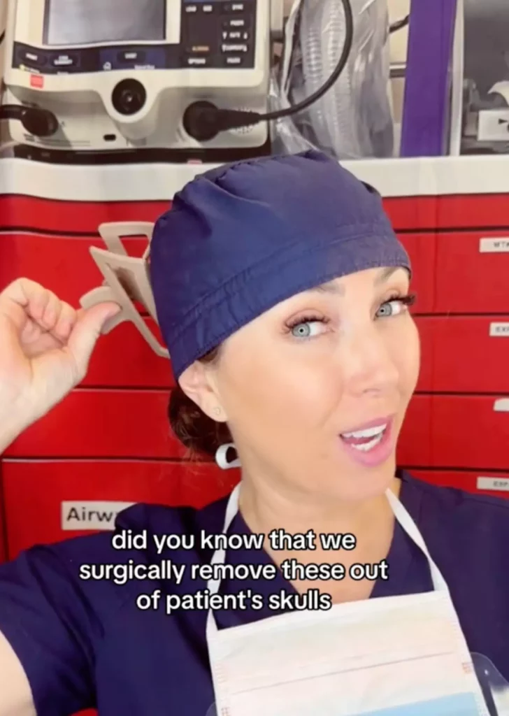 Woman in front of medical machine with a claw clip