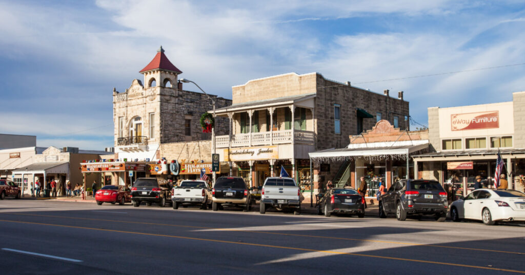 FREDERIKSBURG, TXEXAS - NOVEMBER 19, 2017 - The Main Street in Frederiksburg, Texas, also known as "The Magic Mile", with retail stores and poeple walking