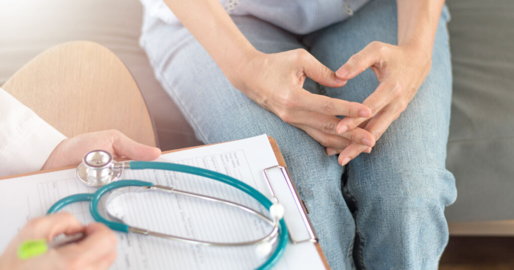 Doctor and patient healthcare concept. Gynecologist physician consulting and examining woman patient health in Obstetrics and Gynecology department in medical hospital health service center.