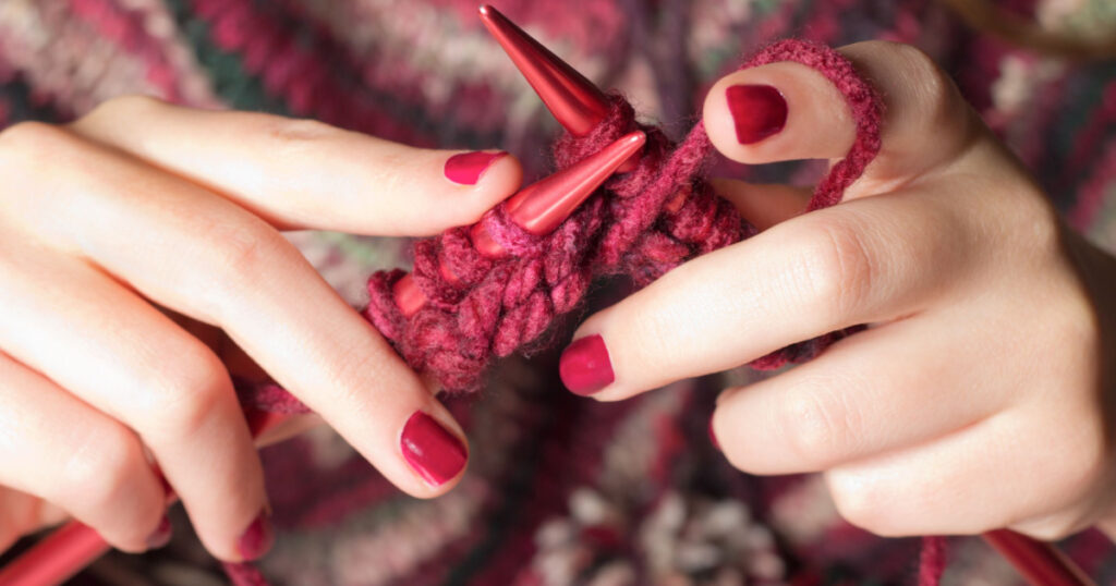 Close-up of hands knitting
