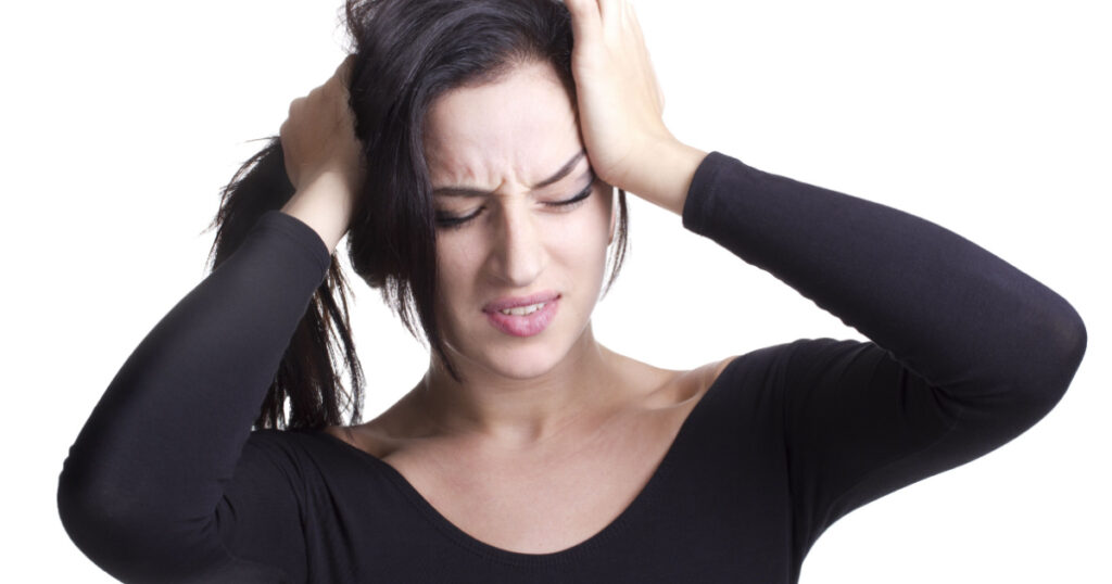 young girl with headache experiencing negative emotions