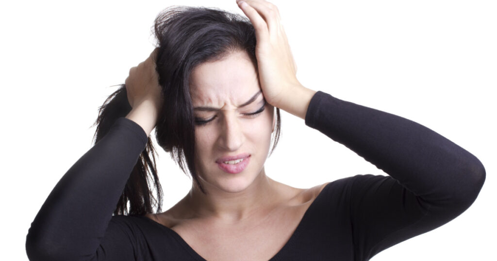 young girl with headache experiencing negative emotions