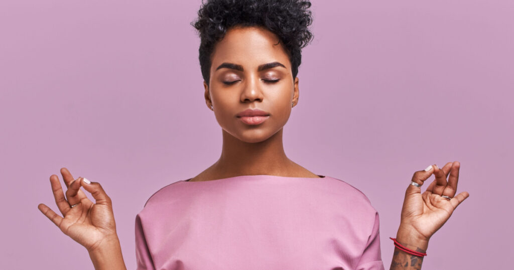 Calm woman relaxing meditating, no stress free relief at work concept, mindful peaceful young businesswoman or student practicing breathing yoga exercises on isolated over lavender background