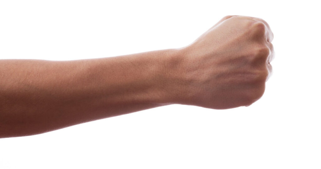 A hand clutched in his fist
