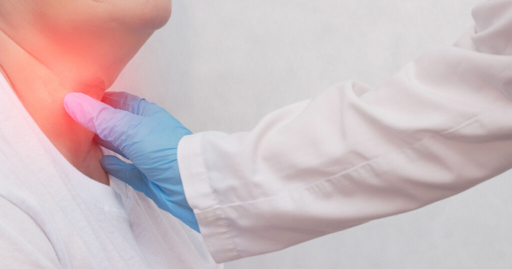 Adult woman on reception at the doctor who has problems with the thyroid gland and the endcrine system, close-up, patient