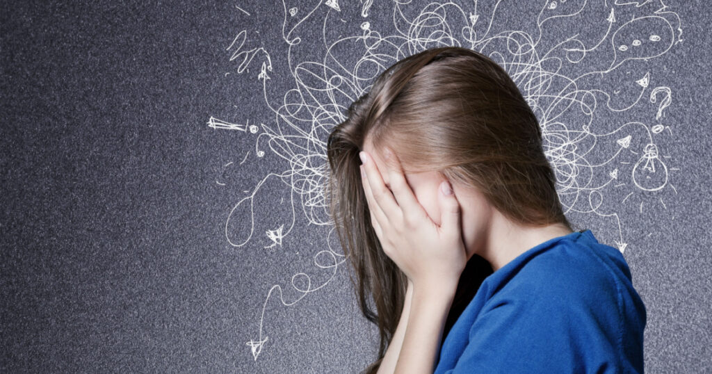 Sad young man with worried stressed face expression and brain melting into lines question marks. Obsessive compulsive, adhd, anxiety disorders concept