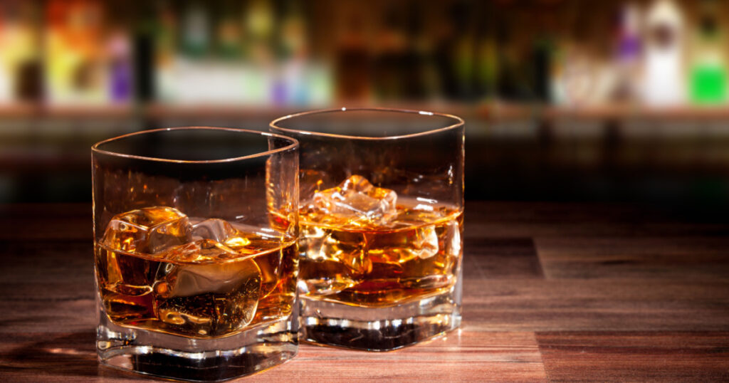 Whiskey drinks on wood