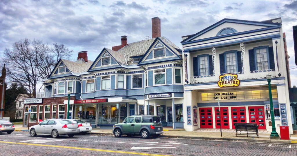 Marietta, Ohio, USA, Jan. 11, 2020: Street view of downtown Marietta with cars parked at curb and the People’s Bank Theatre seen prominently.