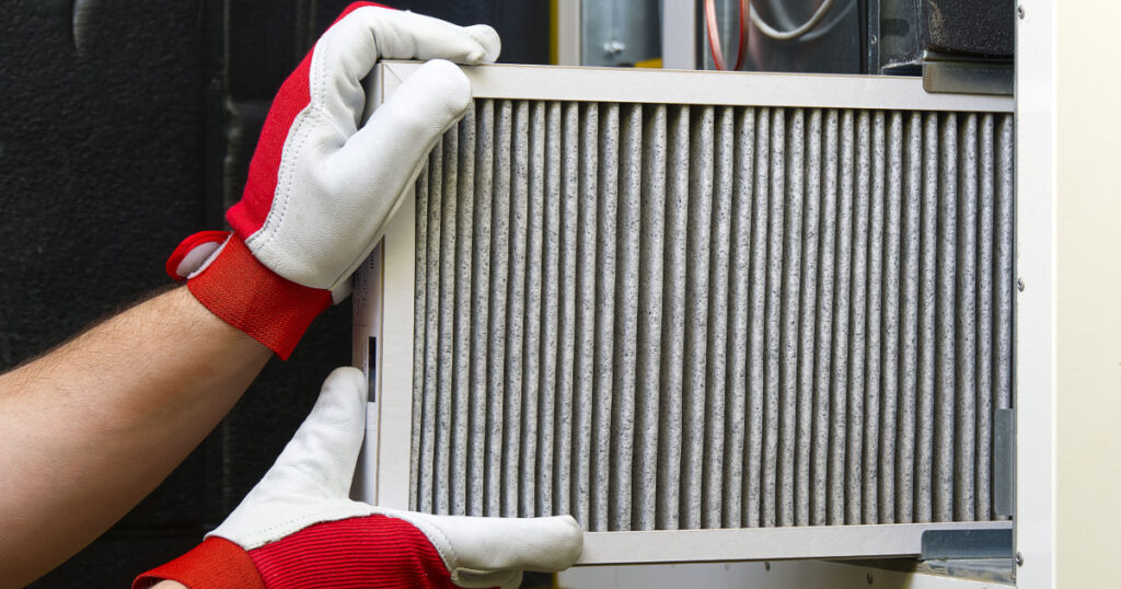 Replacing the filter in the central ventilation system. Replacing Dirty Air filter for home central air conditioning system. Change filter in rotary heat exchanger recuperator.