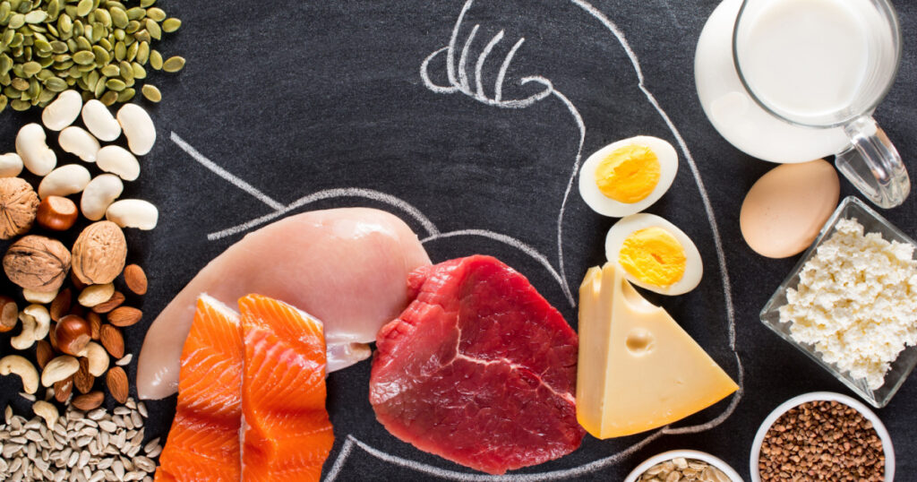 High protein food for body builders as meat, fish, dairy, eggs, buckwheat, oatmeal, nuts, bean, pumpkin seed and sunflower seed. Top view.