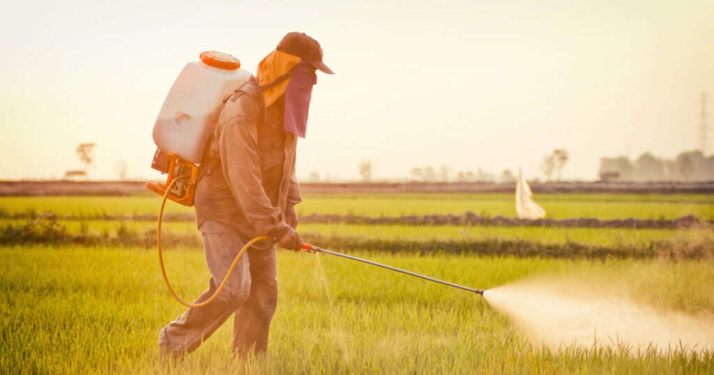 Farmer spraying pesticide